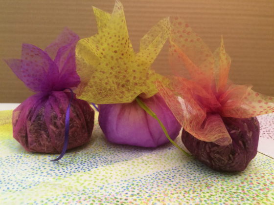 Three Lavender Sachets in delicately coloured shades of purple, lime and rose red. The lavender seeds inside can be seen through the semi-transparent Zeelon