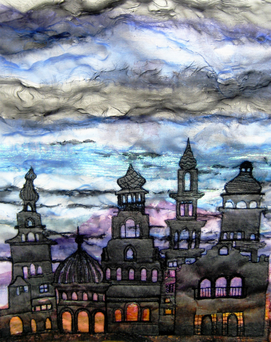 A variet of Eastern style turrets in black Lutradur on top of a colourful blue, purple and orange sky.