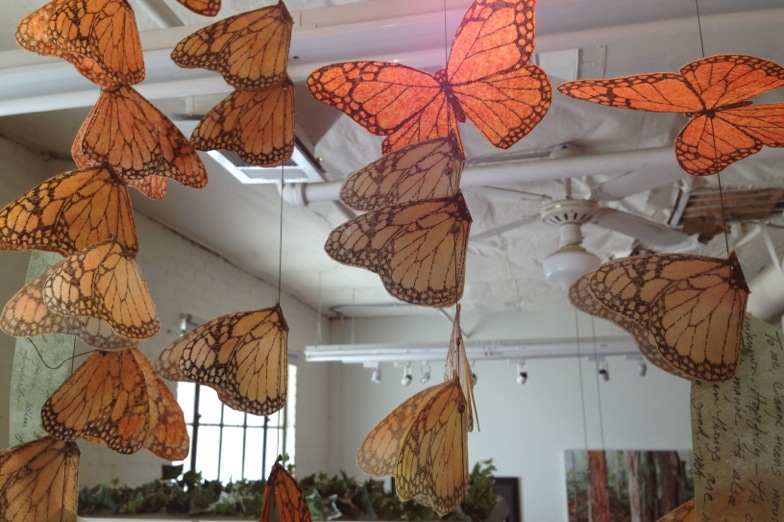 Four strands of butterflies under construction in Merle's studio.