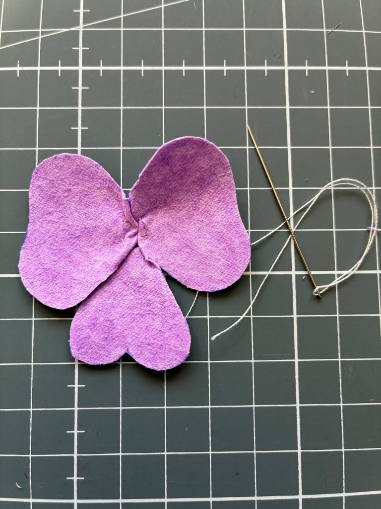 The running stitch has been pulled to form a 'centre'.