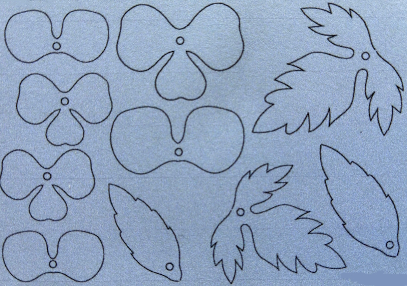 Outline sketches of pansy flowers and leaves on a textured gray background.